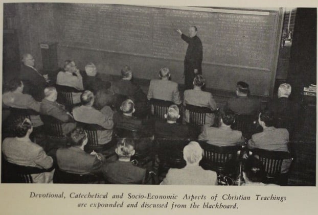 A Jesuit leads a working man's retreat in St. Louis (Courtesy of the Jesuit Archives from the Central and Southern Province)