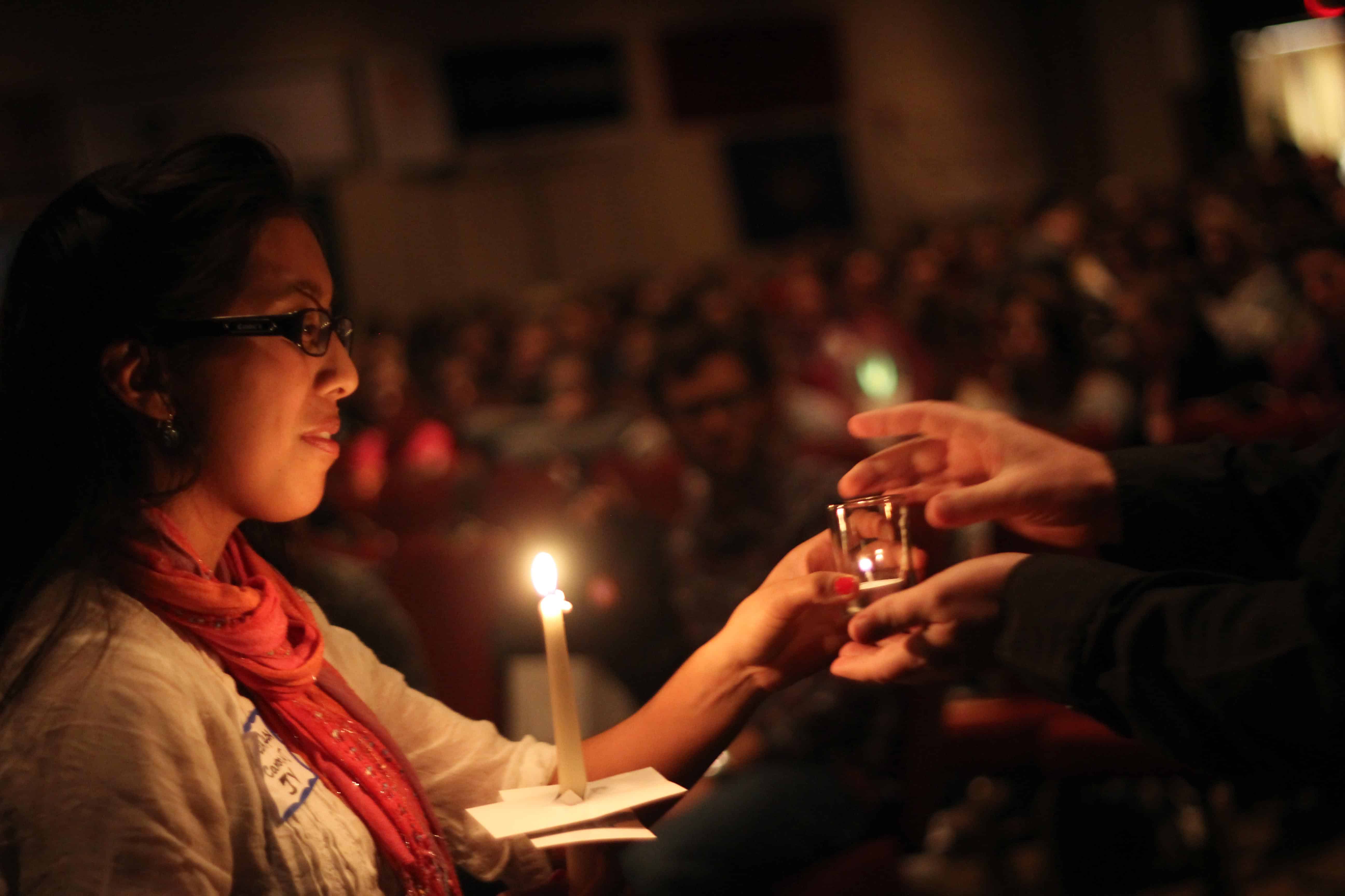 Passing the Light at IFTJ / Image: Ignatian Solidarity Network