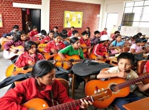 Students learning the guitar