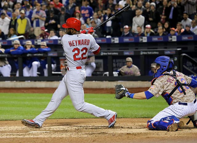 Jason Heyward swings at a pitch in the ninth inning.