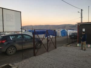 View from the school yard of a refugee camp, with Syria in the distance.
