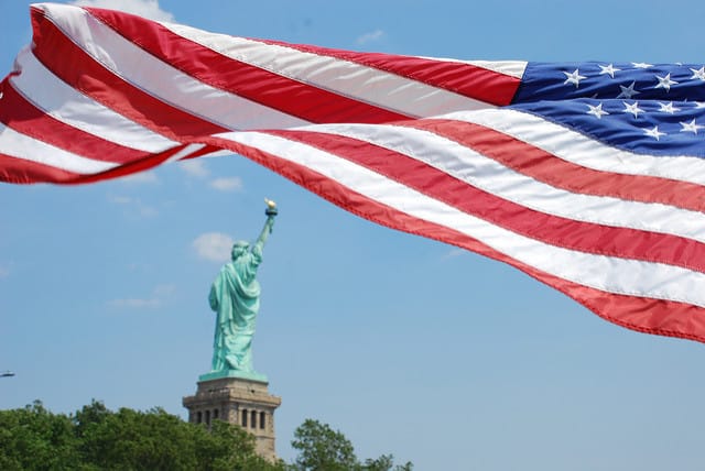 U.S. flag with Statue of Liberty